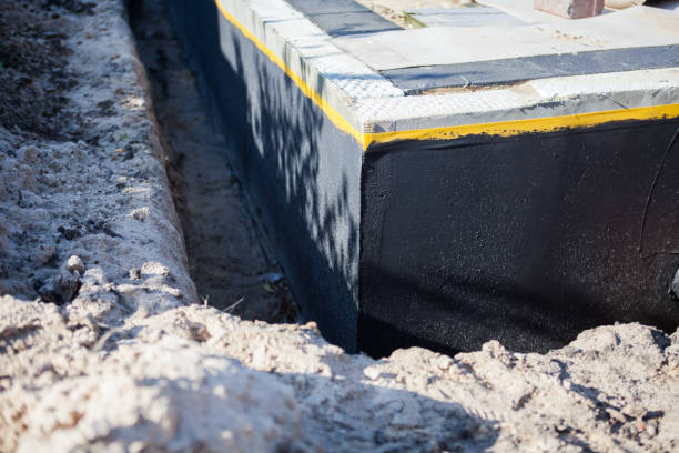 Professional Waterproofing technician working in Bath, NY